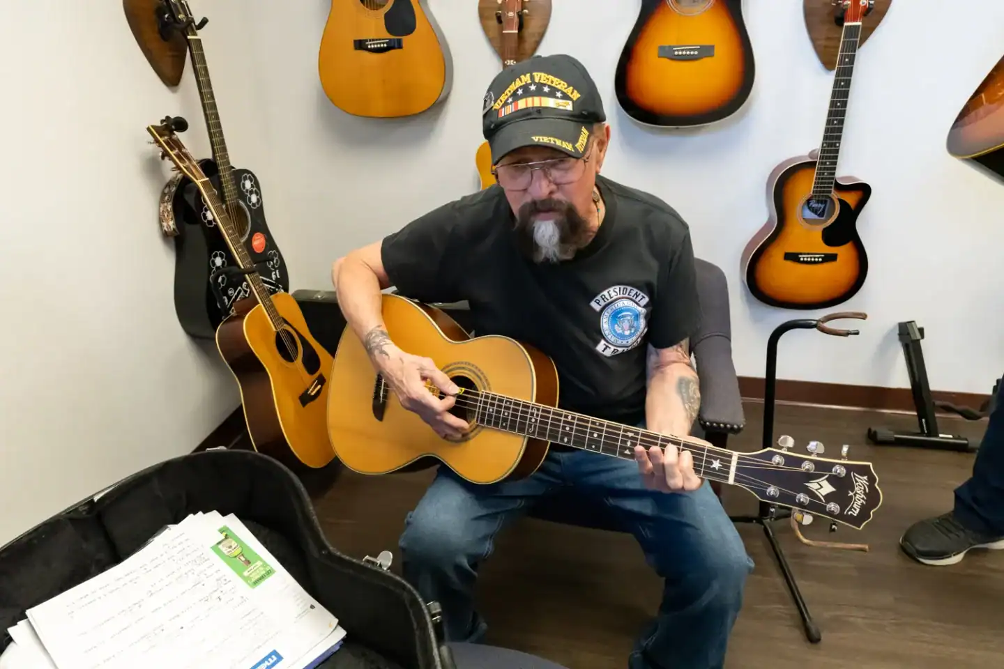 Man playing guitar as part of VFW National Home’s Guitars for Vets program.