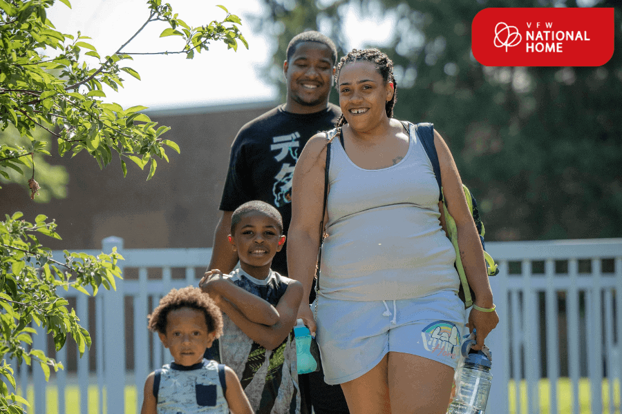 Military family with dependents walking across VFW National Home’s campus.