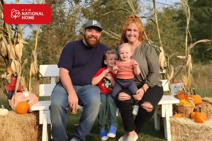 Military family posing for a photo at VFW National Home's Fall Family Fun Festival.